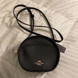 Brand new Coach crossbody bag. It has never been used. Circular shape